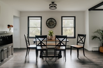 A dining room with a clock on the wall