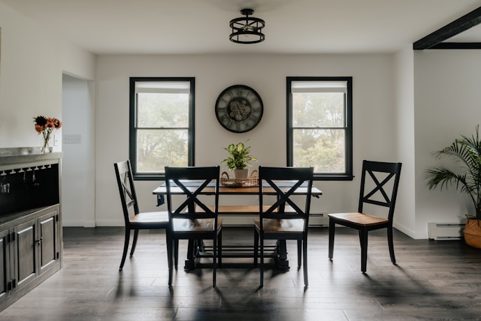 A dining room with a clock on the wall