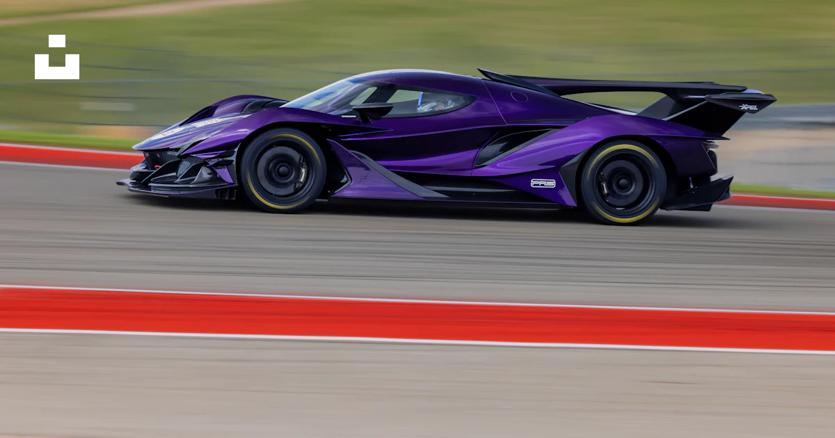 Purple Car Racing A purple sports car driving down a race track photo – Free Zonda Image ...