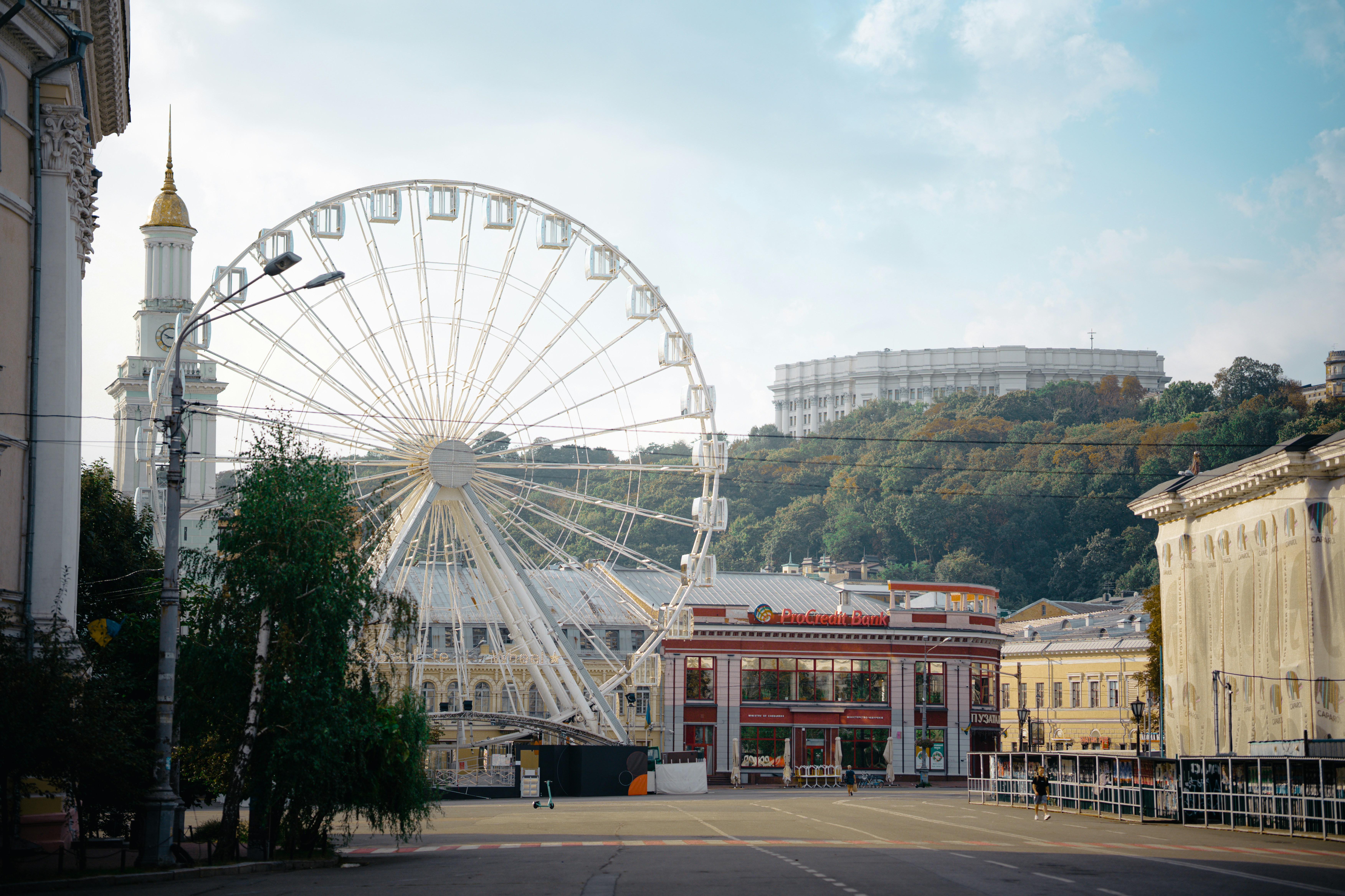A large ferris wheel sitting in the middle of a street