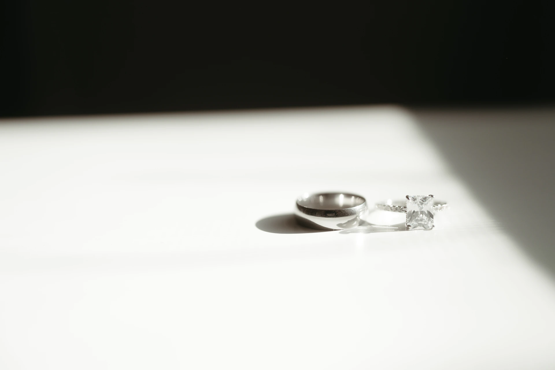 A pair of wedding rings sitting on top of a table