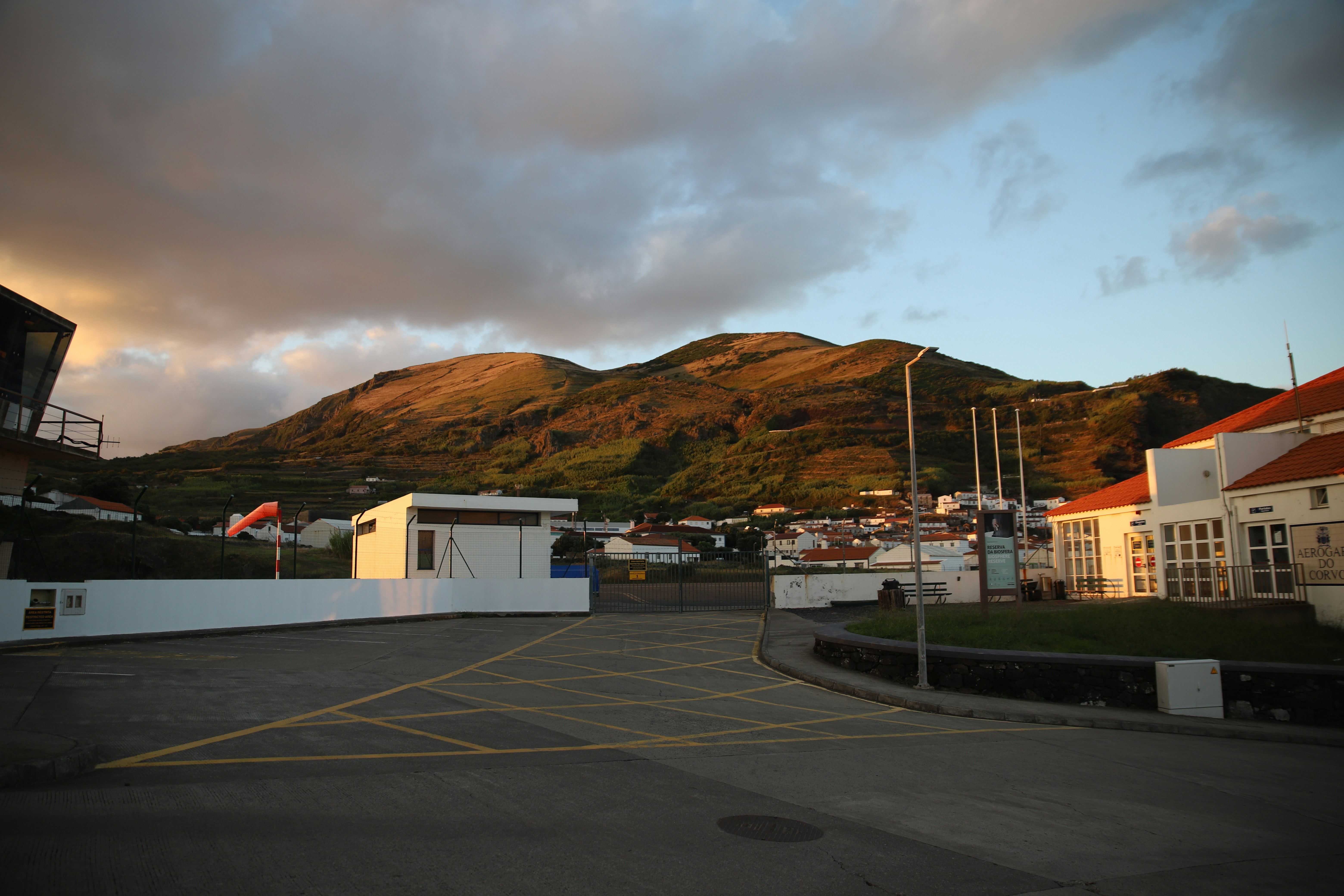 A parking lot with a mountain in the background
