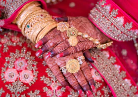 A close up of a woman&amp;amp;amp;amp;#x27;s hands with jewelry on it