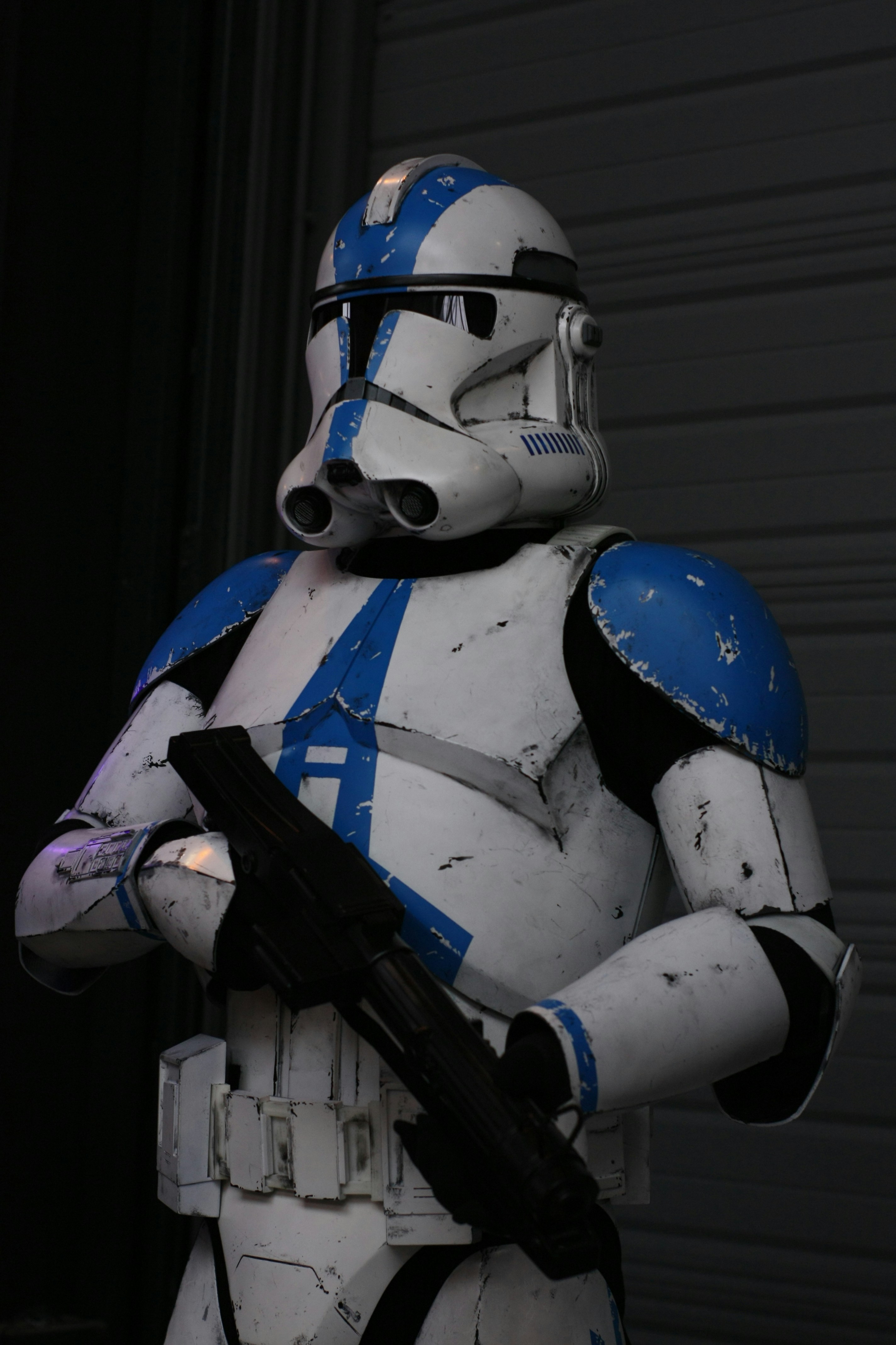 A man dressed as a stormtrooper holding a gun