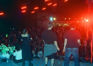 A group of people standing on top of a stage