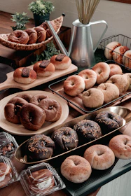 A table topped with lots of different types of donuts