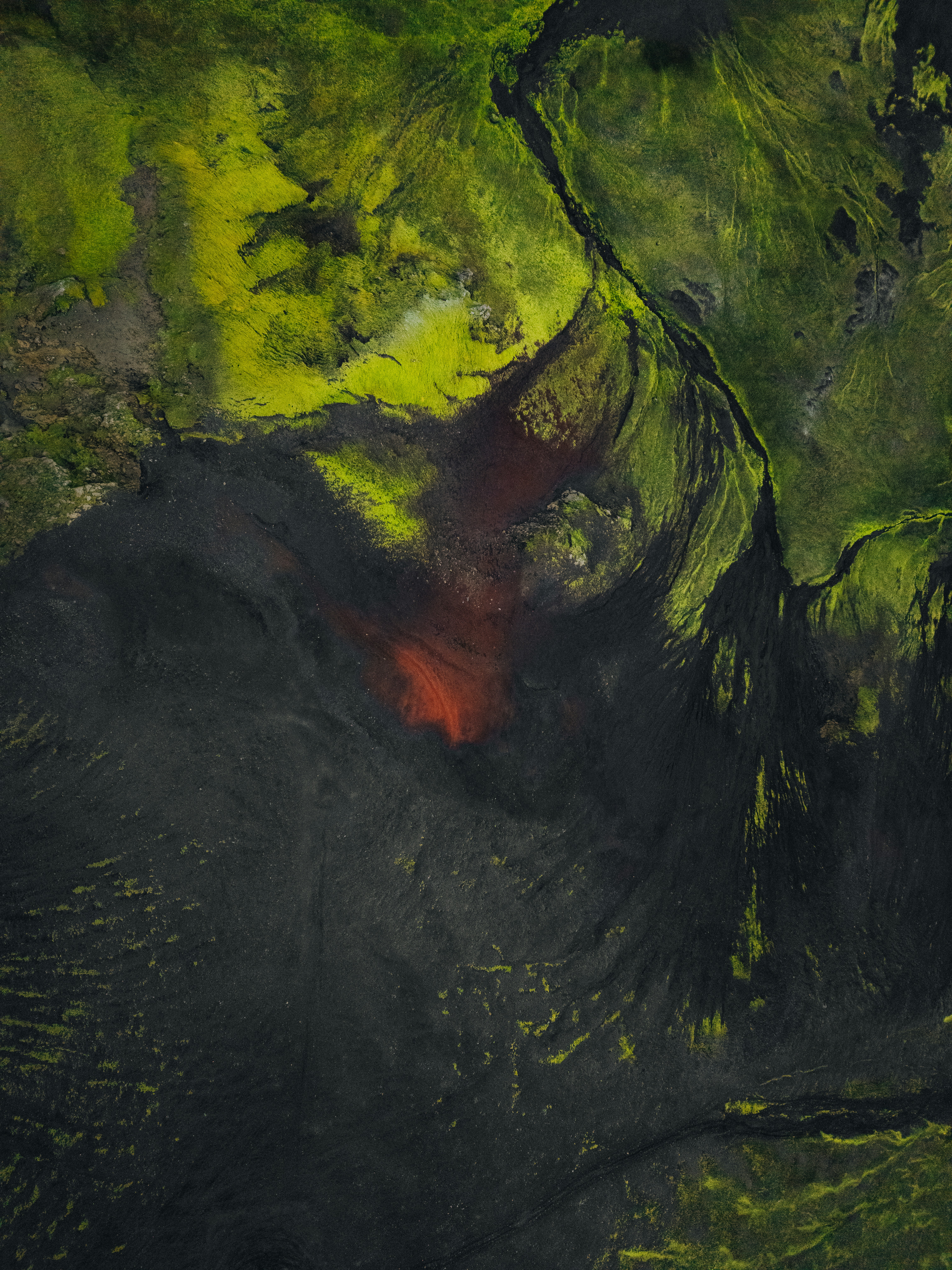 A satellite image of a green and black area