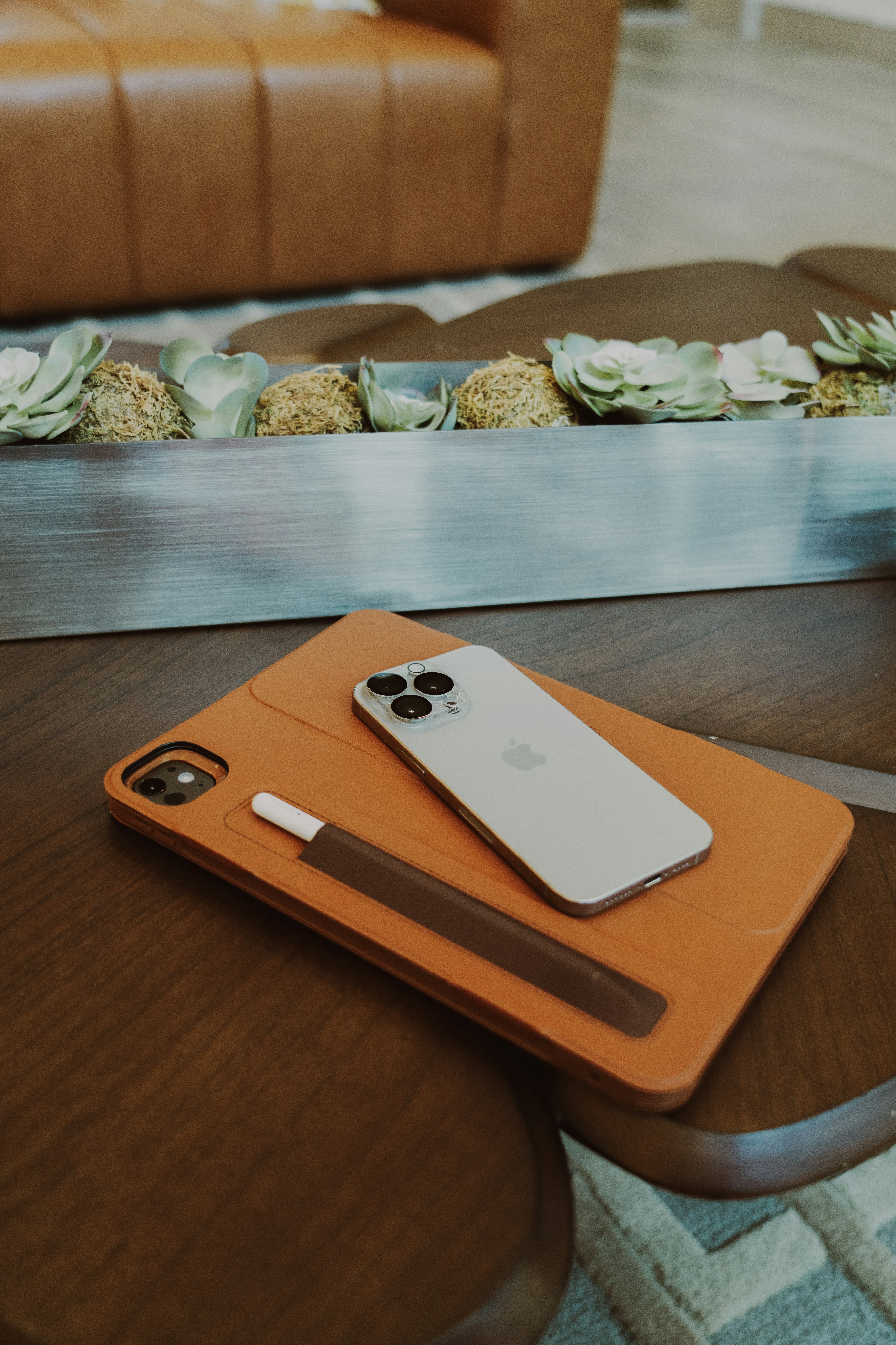 A cell phone sitting on top of a wooden table