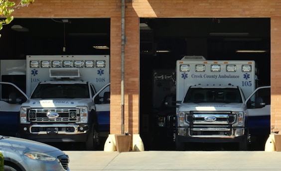 A couple of trucks parked in front of a building