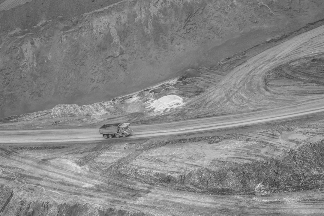 A black and white photo of a mountain road,
