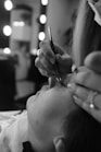 A woman getting her hair cut by a hair stylist