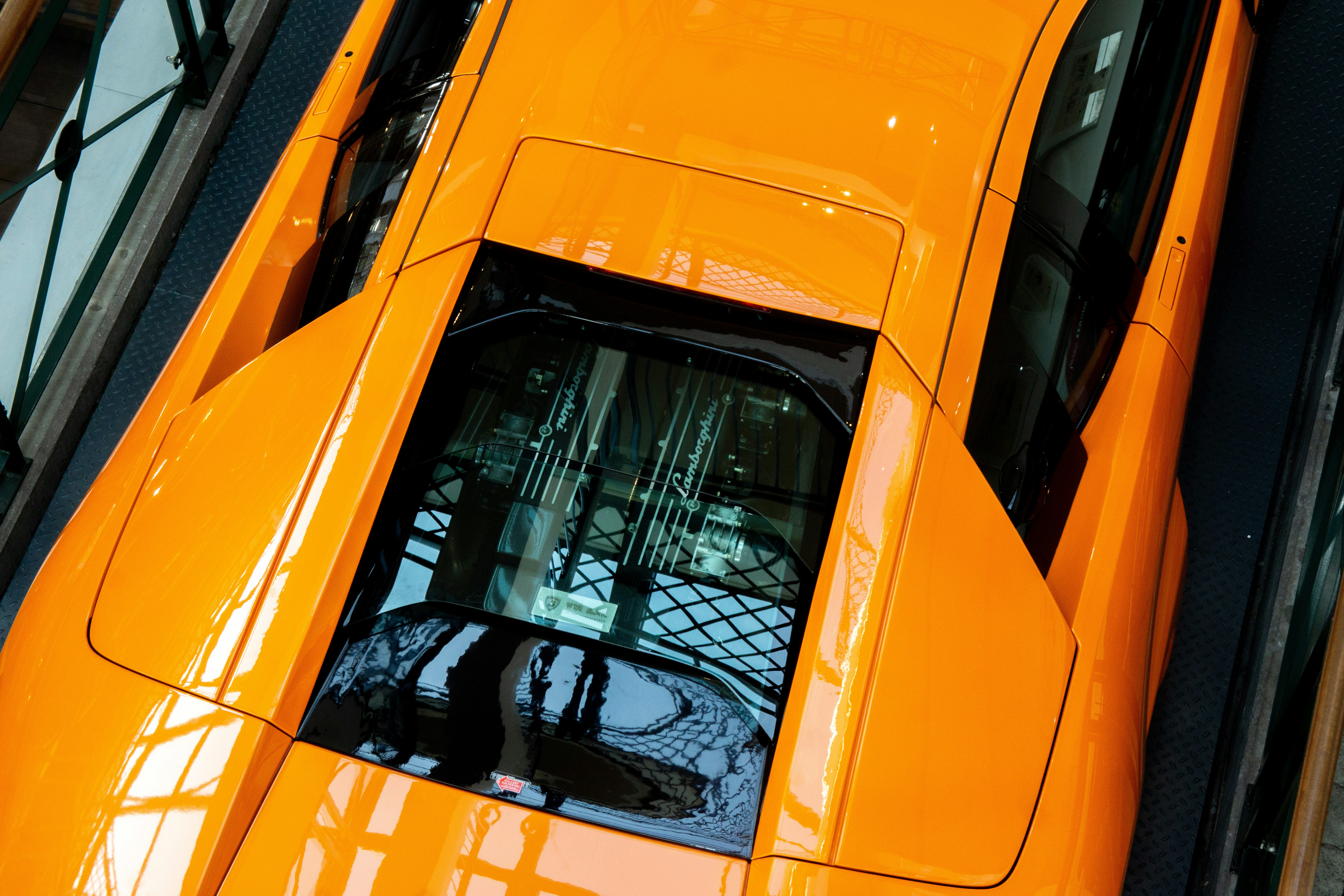Luxury car being securely loaded for transport