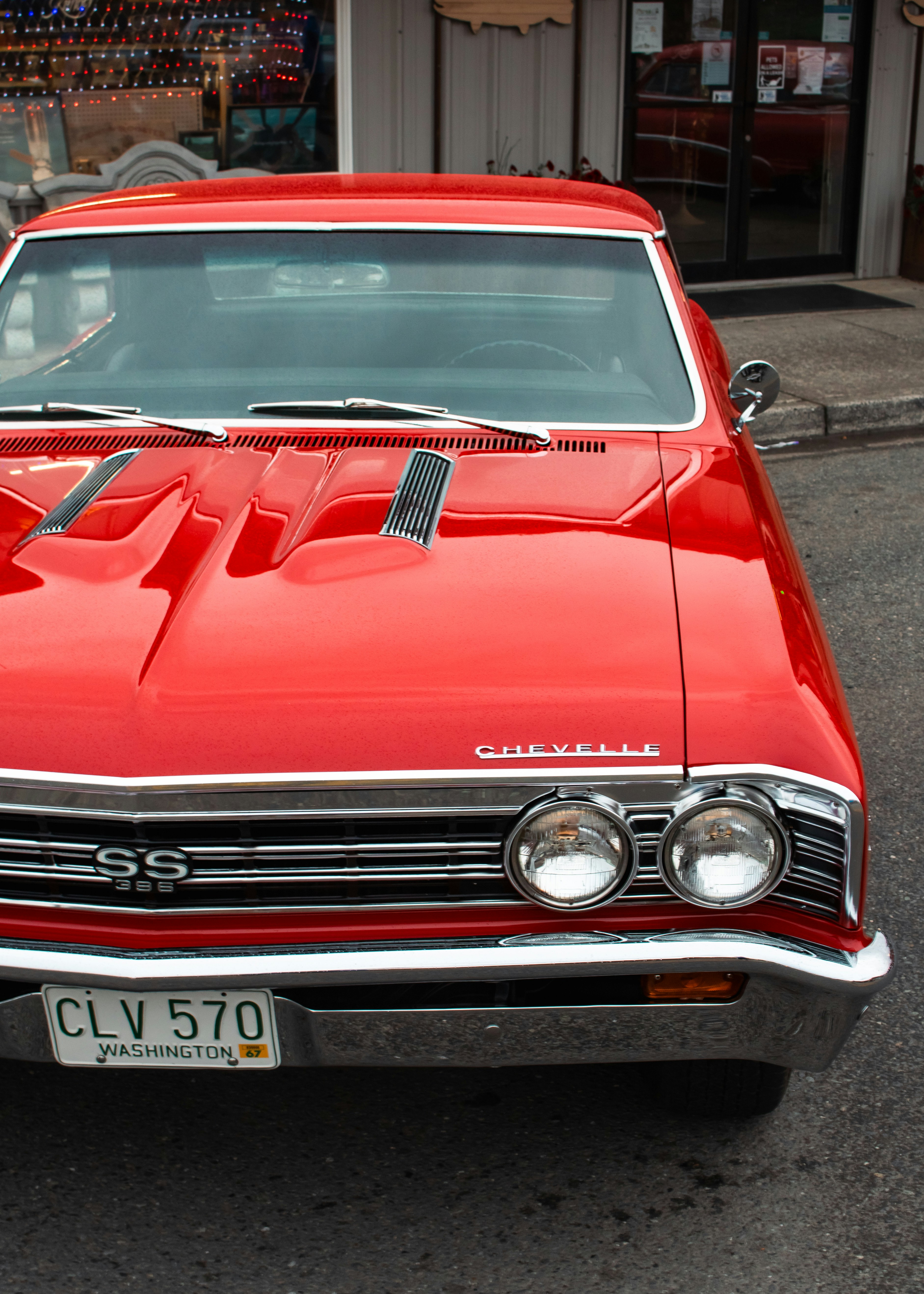 A red car parked on the side of the road