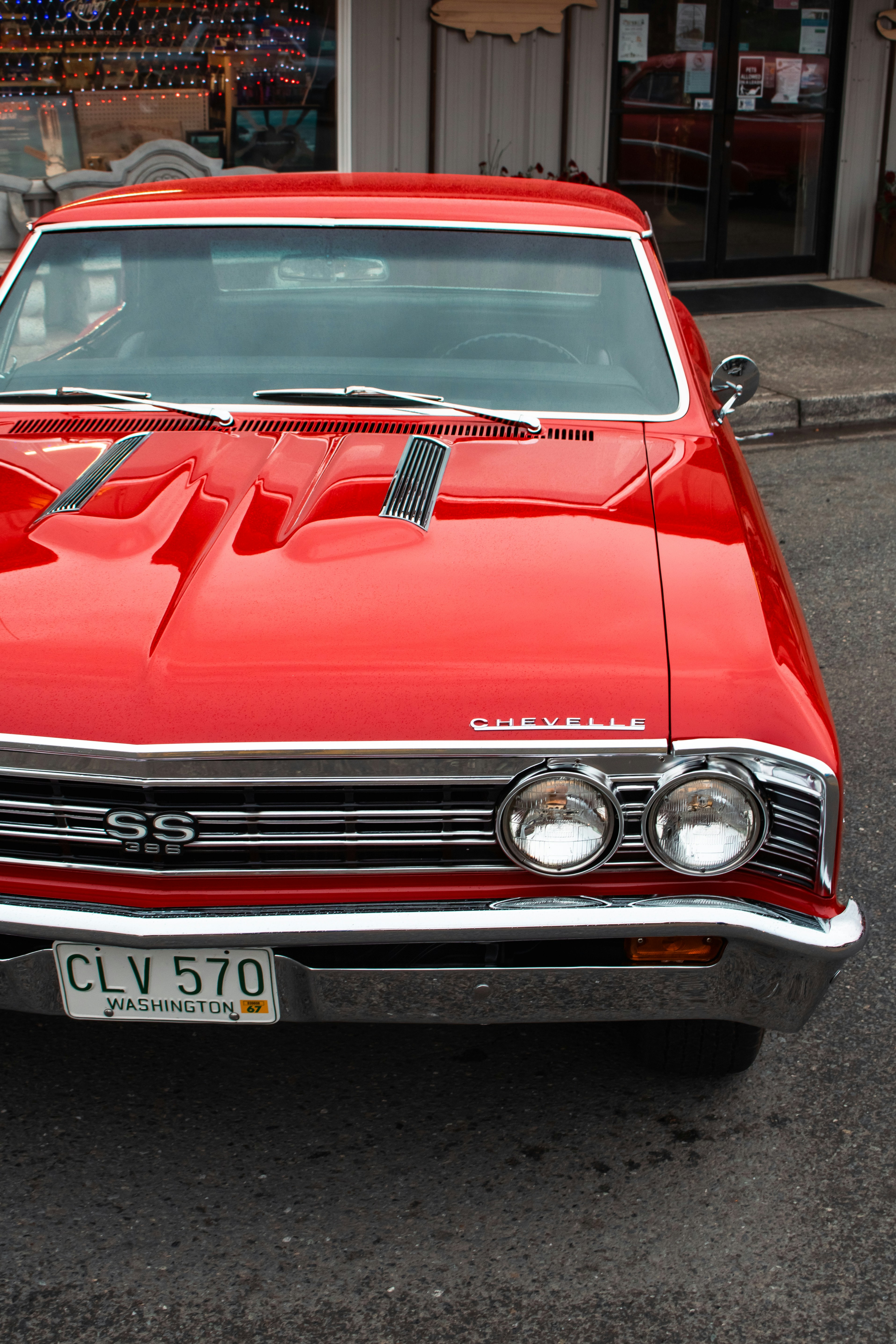 A red car parked on the side of the road