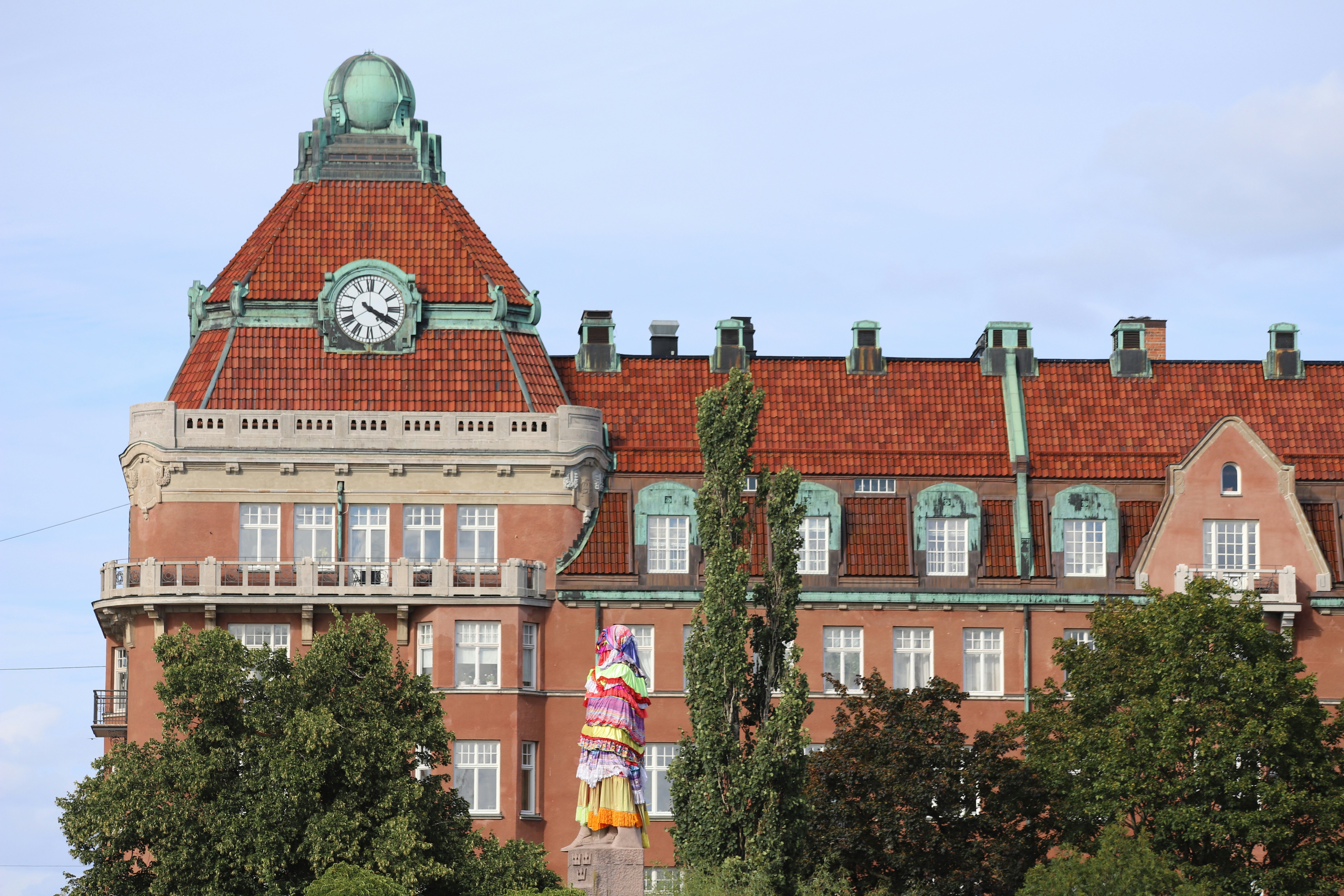 A large building with a clock on the top of it