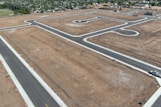An aerial view of an airport with a runway