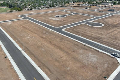 An aerial view of an airport with a runway