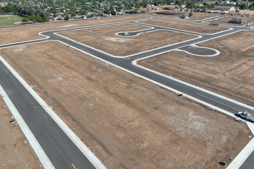An aerial view of an airport with a runway