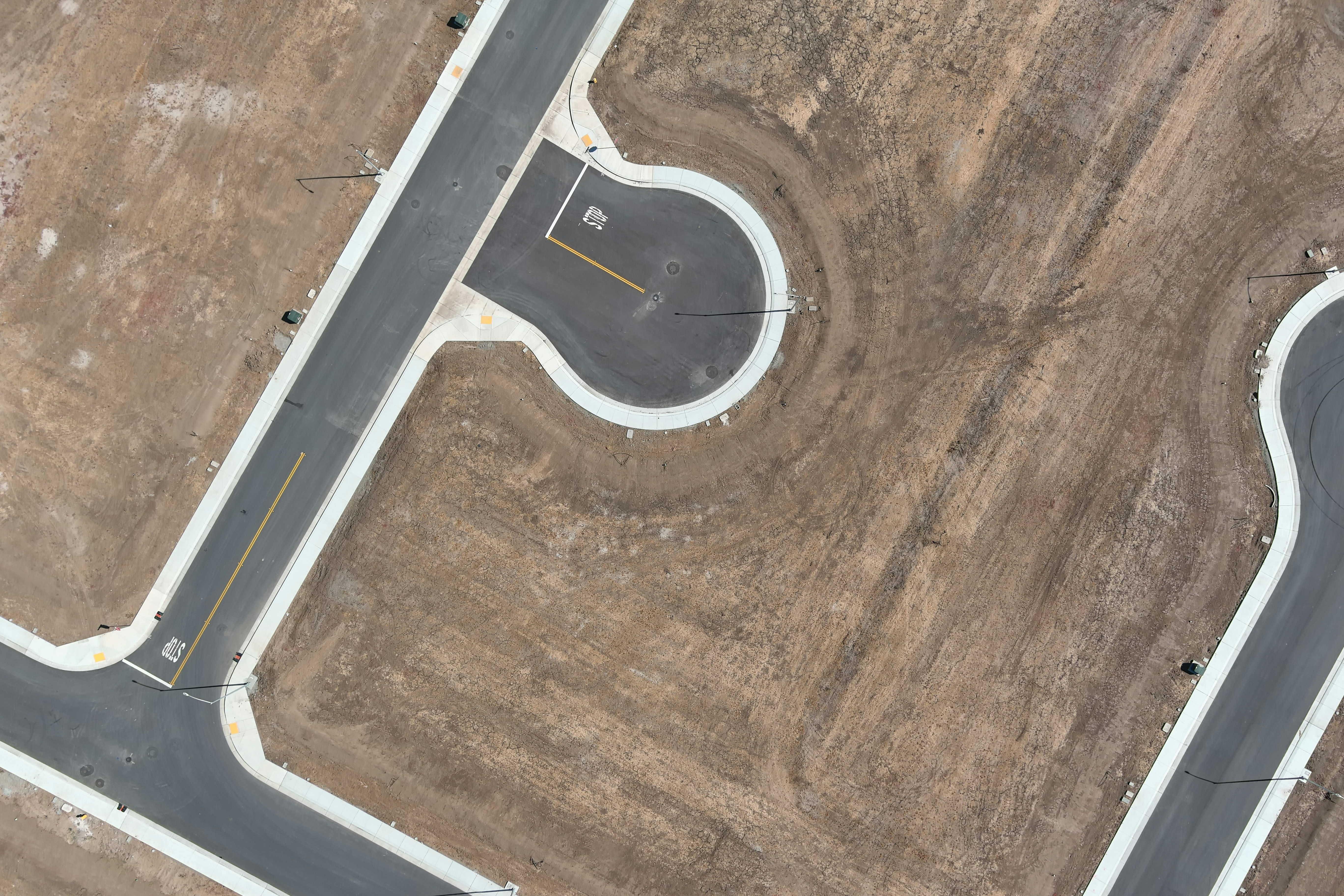 An aerial view of a road in the middle of nowhere