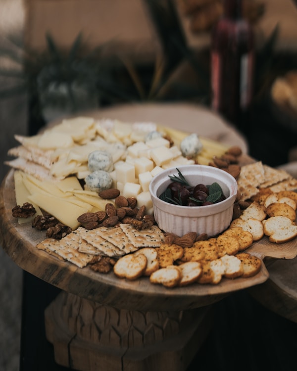 A platter of cheese and crackers on a table