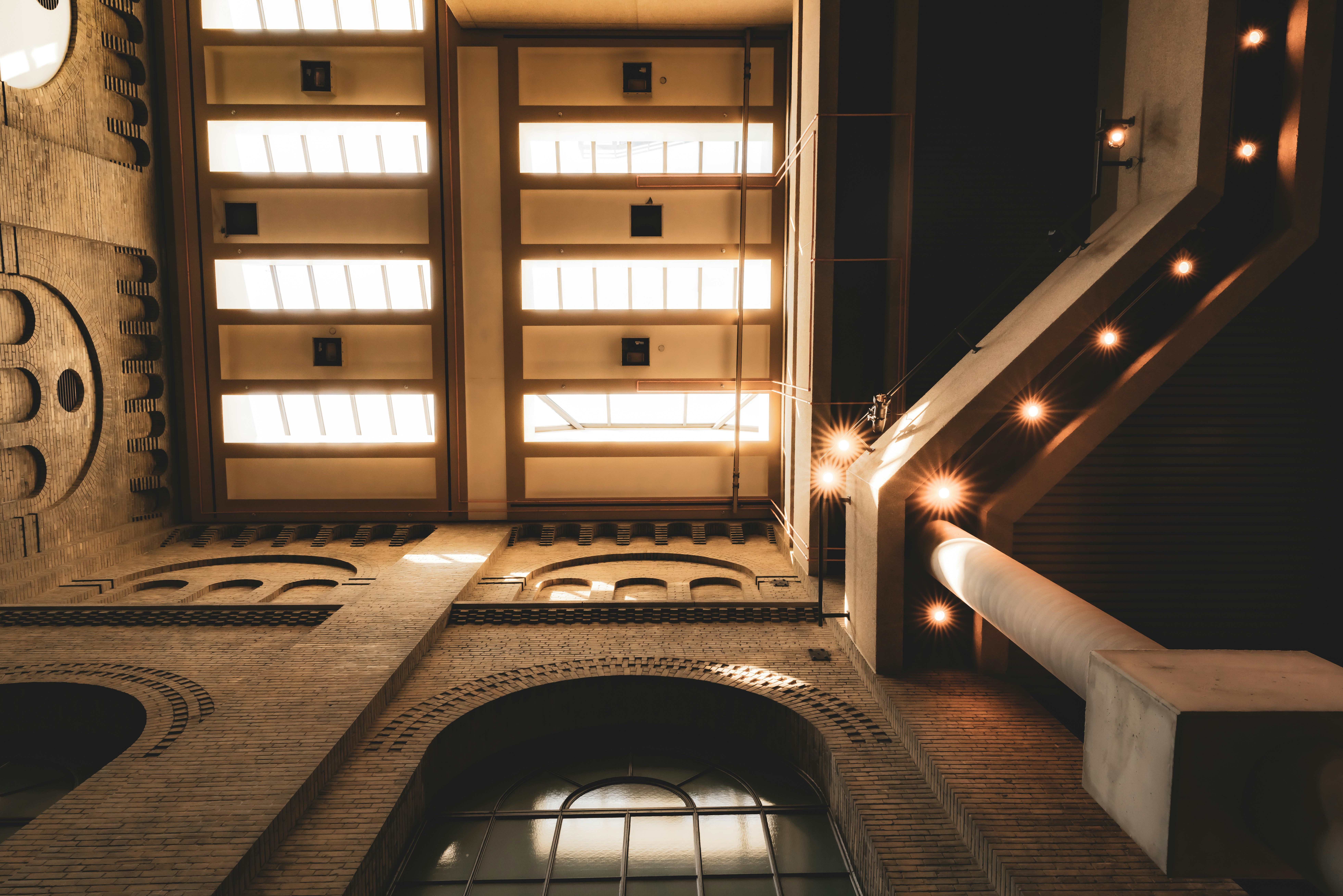 A stairway leading to a building with a clock on the wall