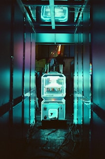 A refrigerator in a room with neon lights