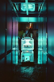 A refrigerator in a room with neon lights