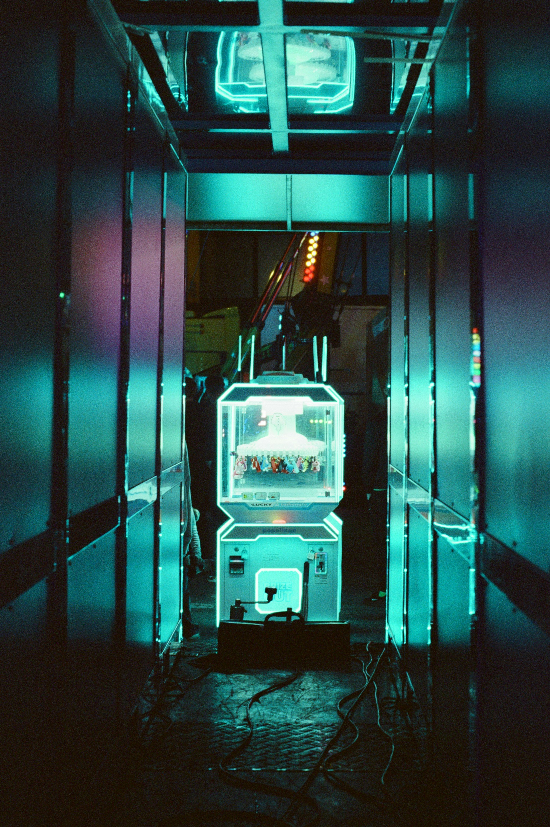 A refrigerator in a room with neon lights