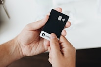 A person holding a cell phone in their hand