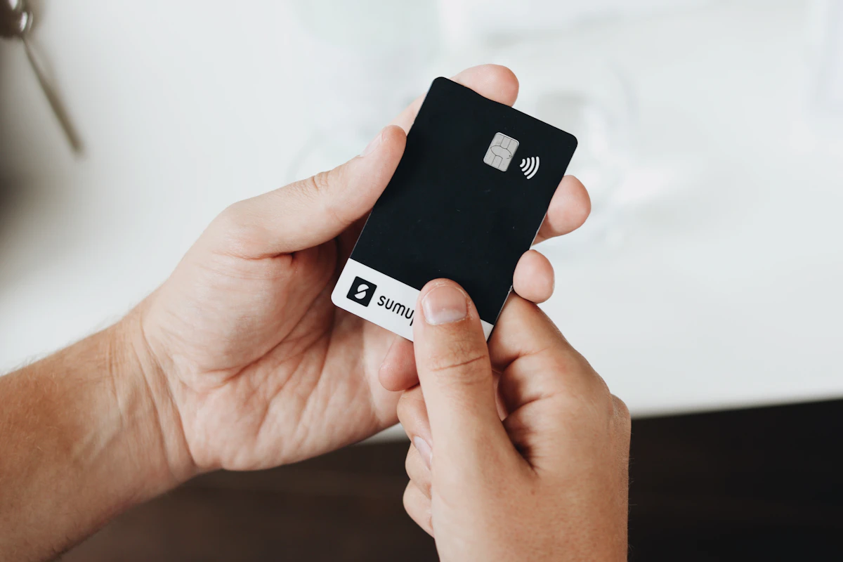 A hardware wallet and recovery phrase card used to self-custody cryptocurrency