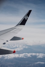 A view of the wing of an airplane in the sky