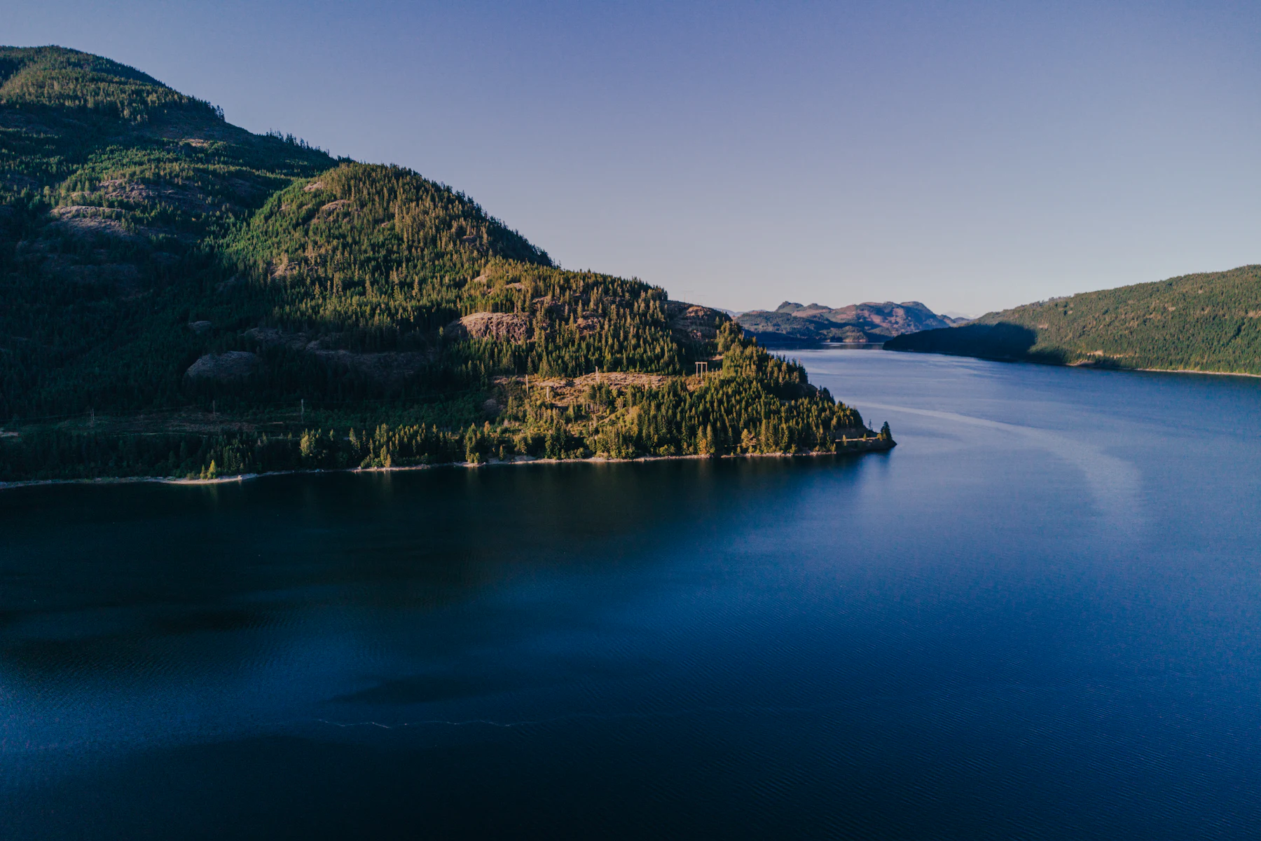 Open water ringed by mountains at Lake Country