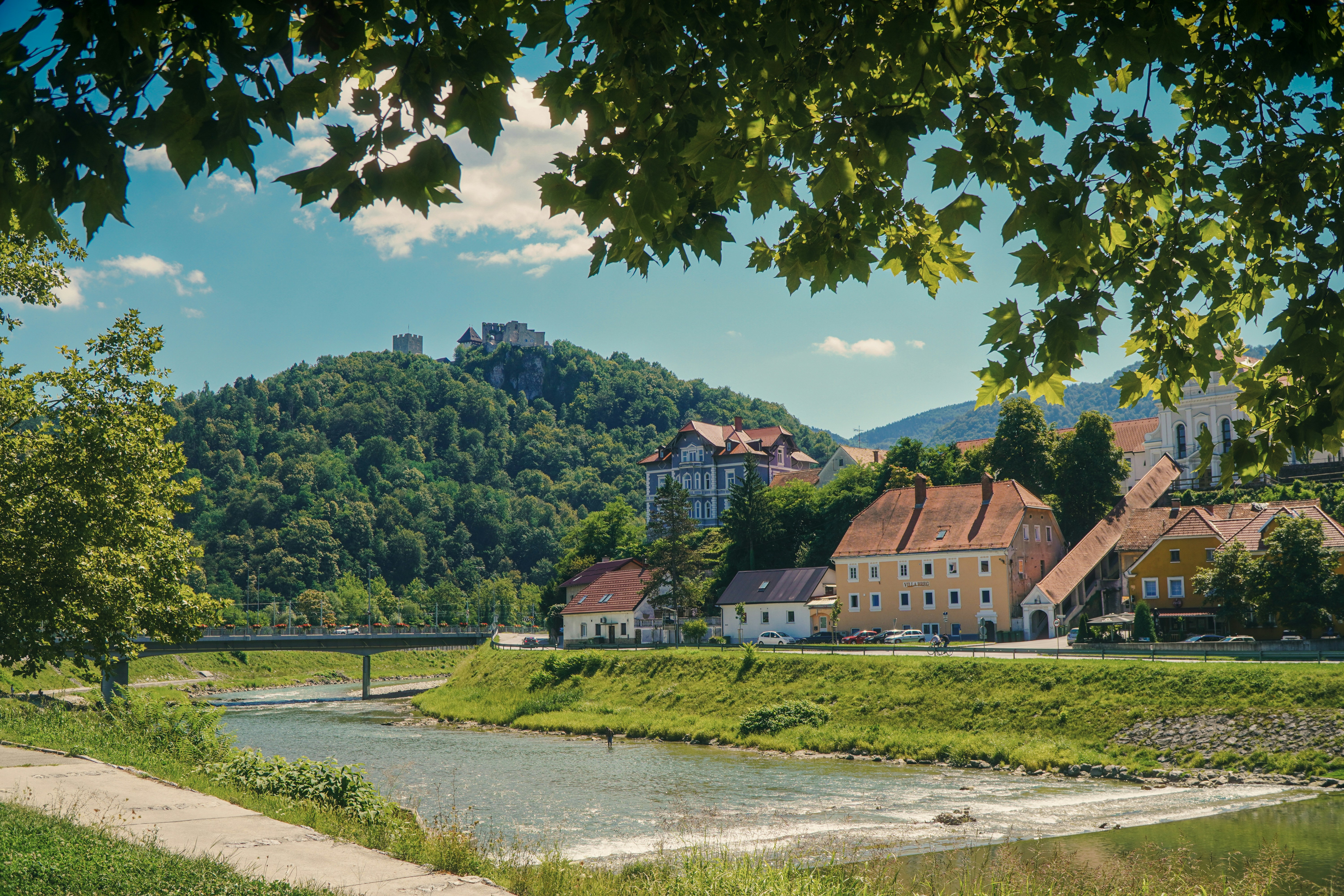 A river running through a lush green countryside