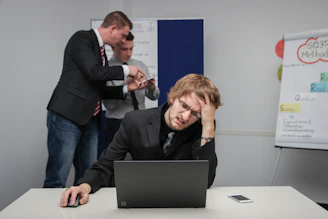 A man sitting in front of a laptop computer
