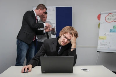 A man sitting in front of a laptop computer