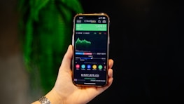 A person holding a smart phone in their hand