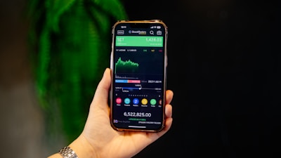 A person holding a smart phone in their hand