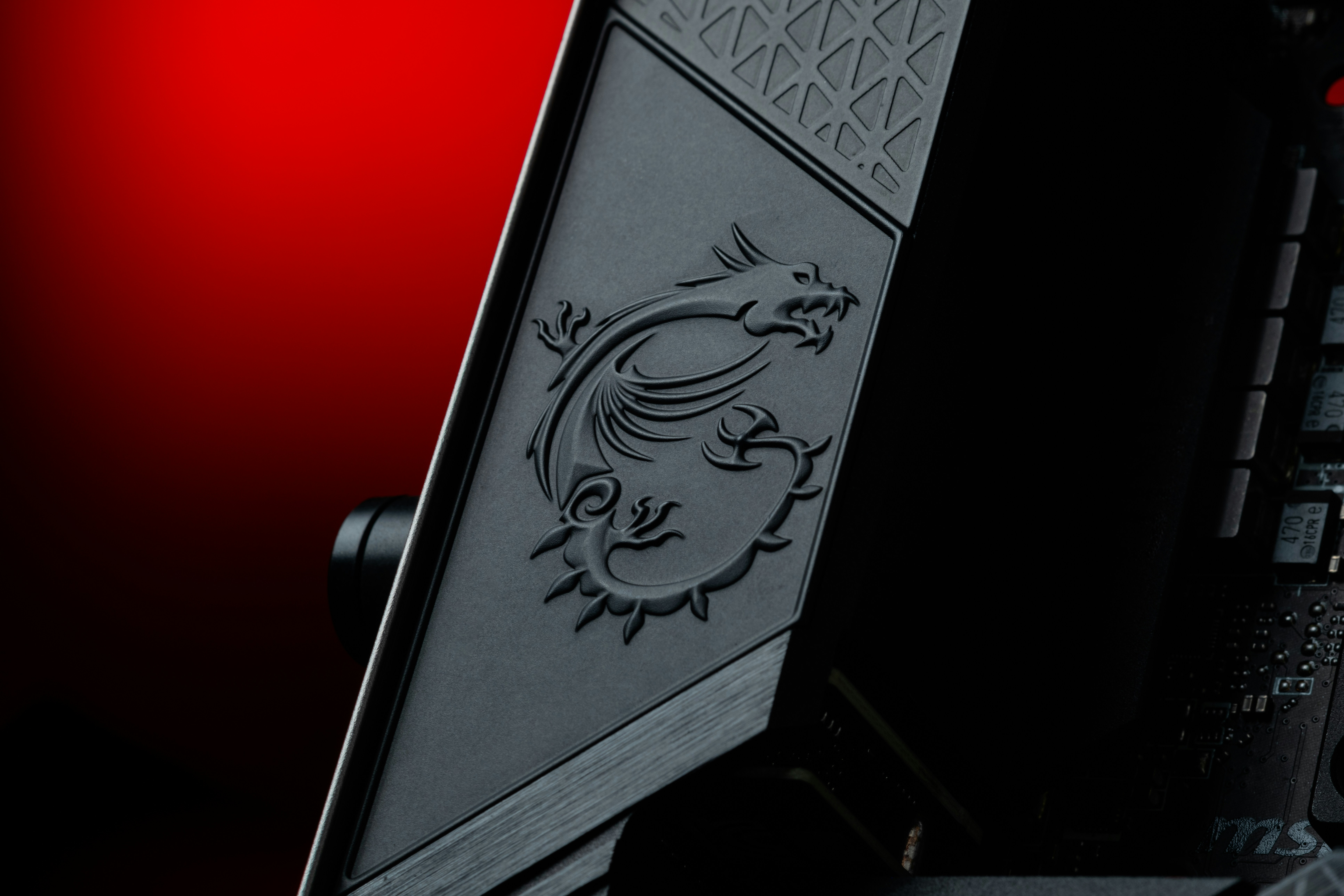 A close up of a computer with a red background