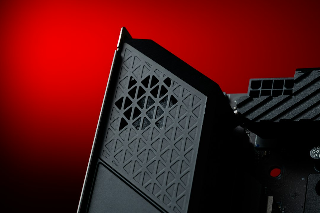 A close up of a computer with a red background