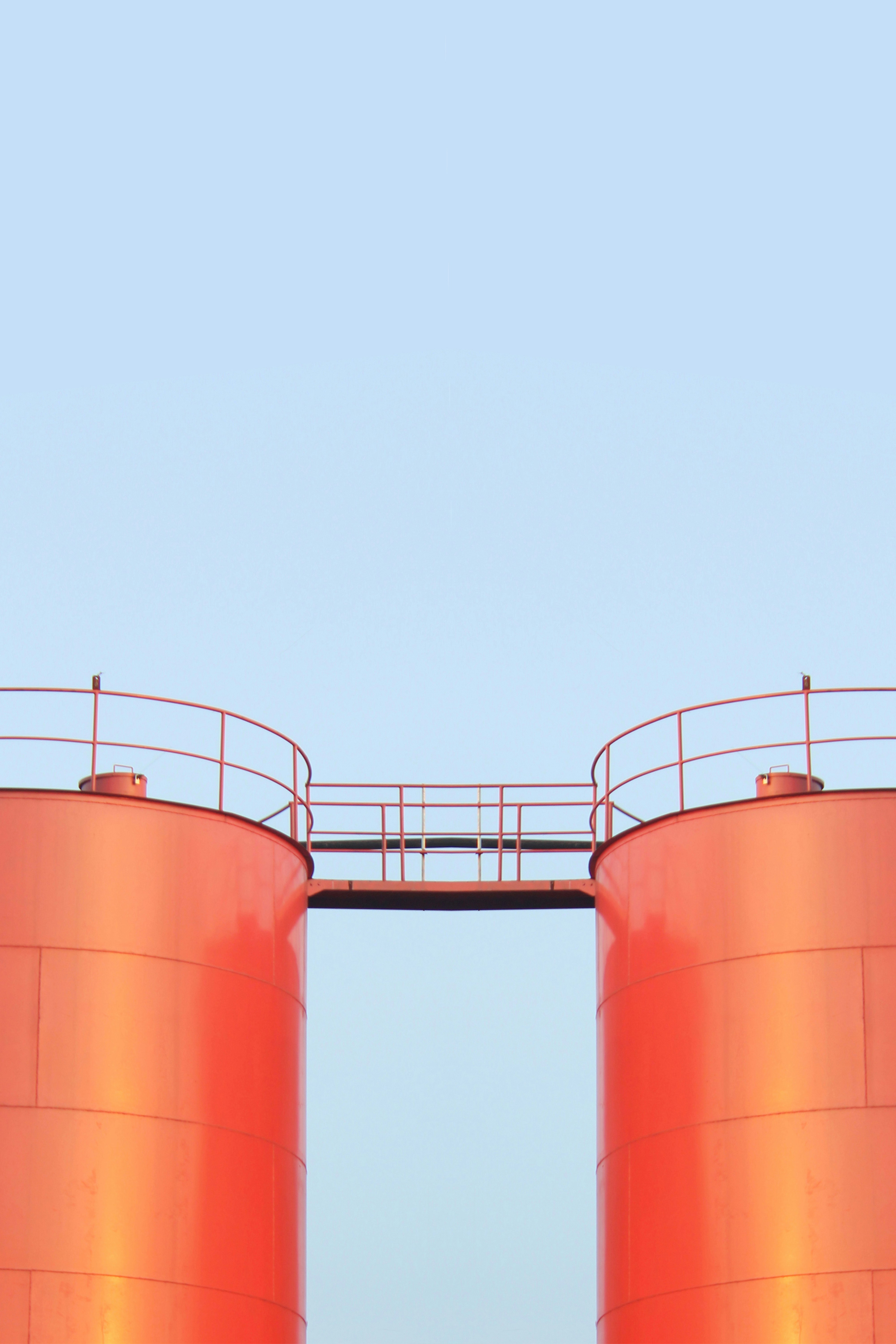 A couple of large red tanks sitting next to each other