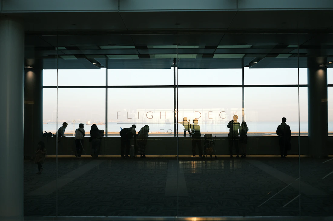 Aviation crew by an airport window