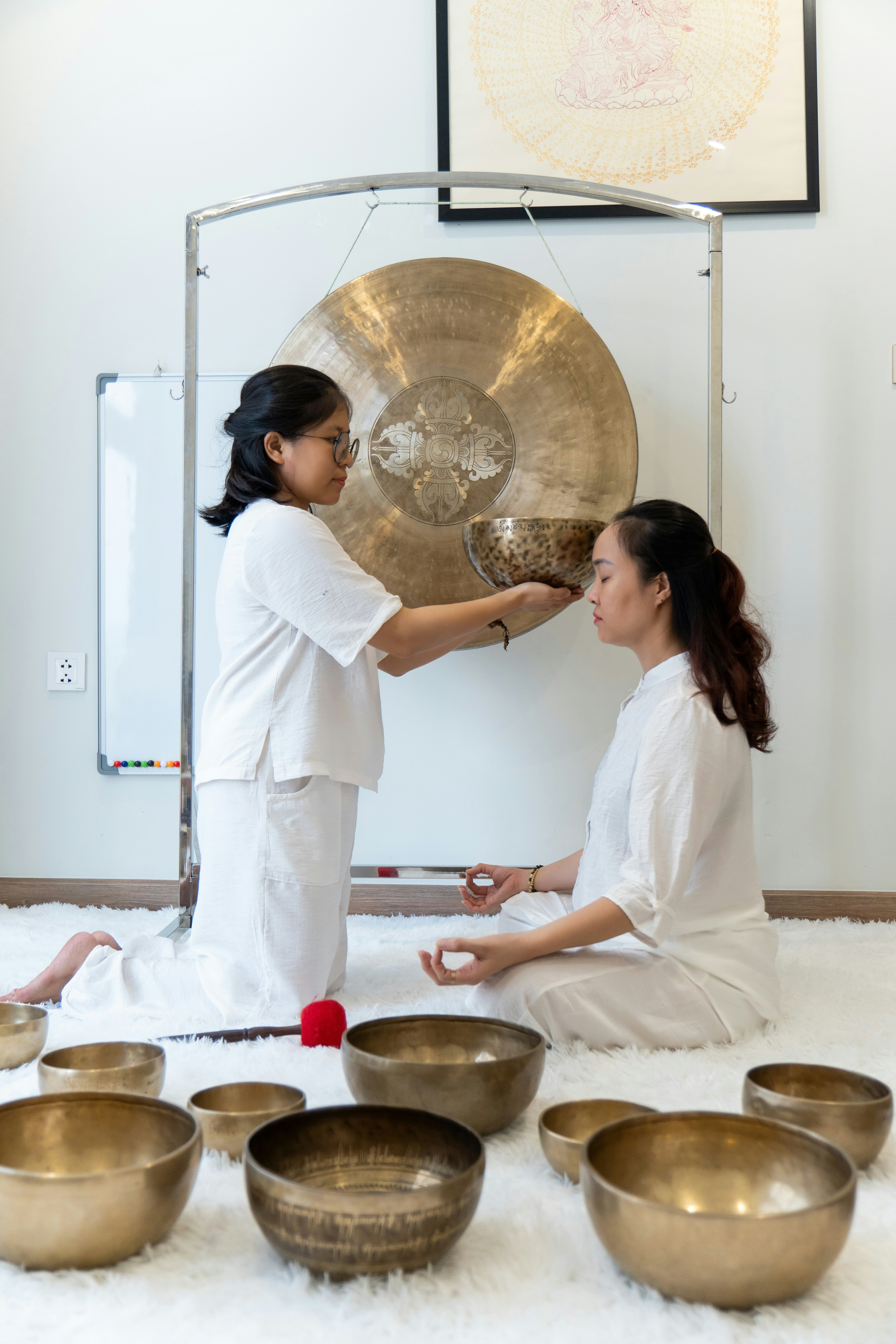 Singing bowl with gentle ripples of water, spiritual sound healing session