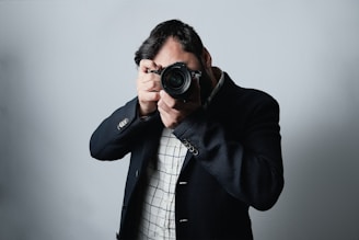 A man taking a picture with a camera
