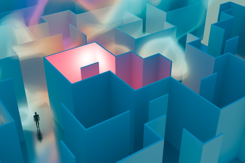 A man standing in a maze of blue and pink shapes