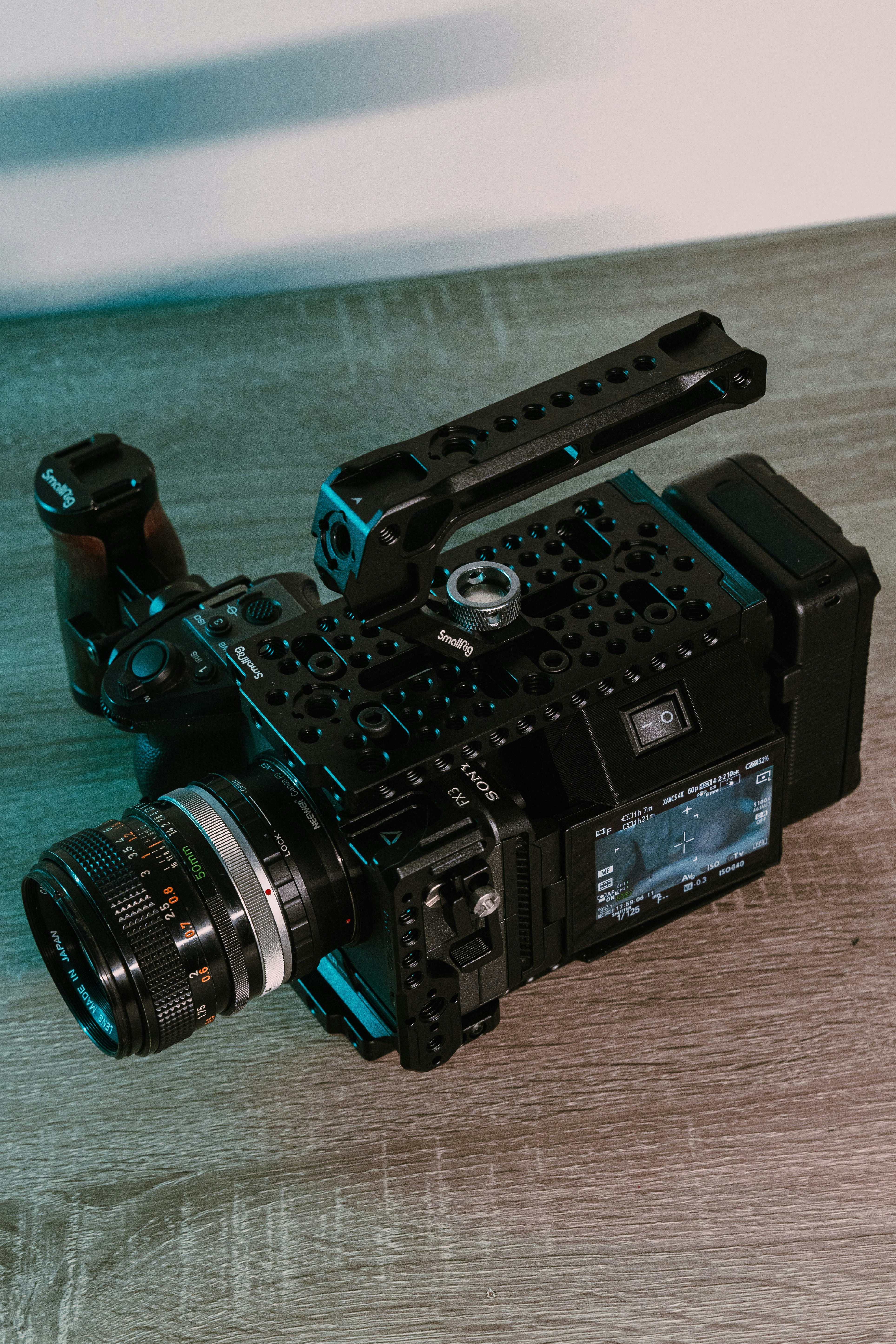 A camera sitting on top of a wooden table