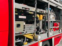A red fire truck parked on the side of the road