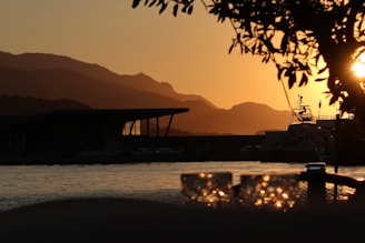 The sun is setting over a body of water