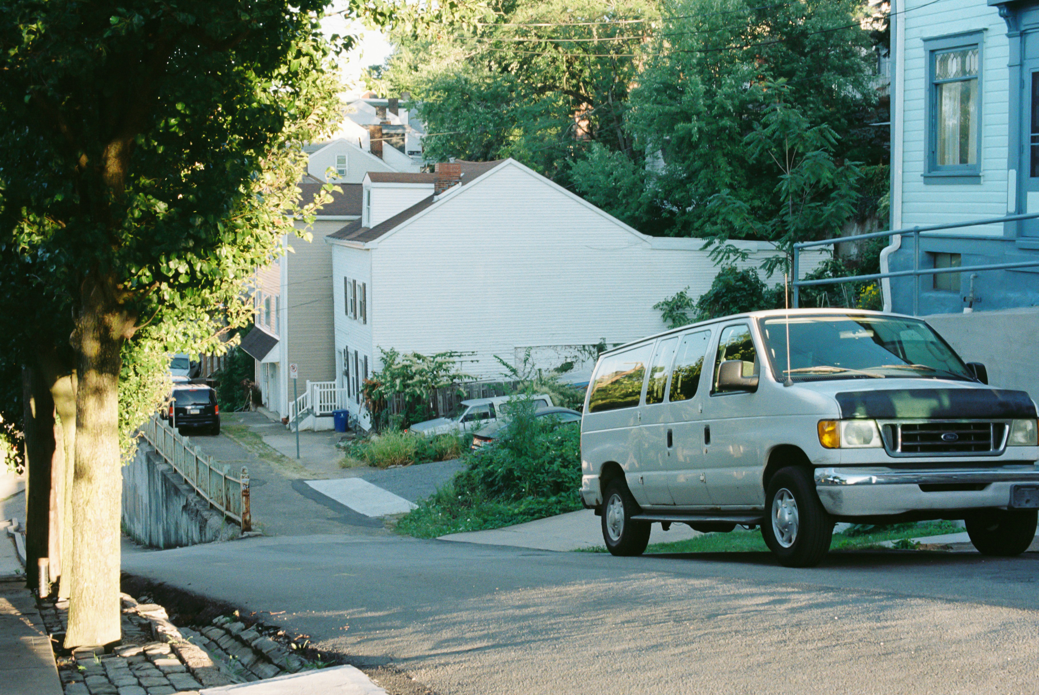 friendly tradesperson with a van arriving at a house - do i need home emergency cover