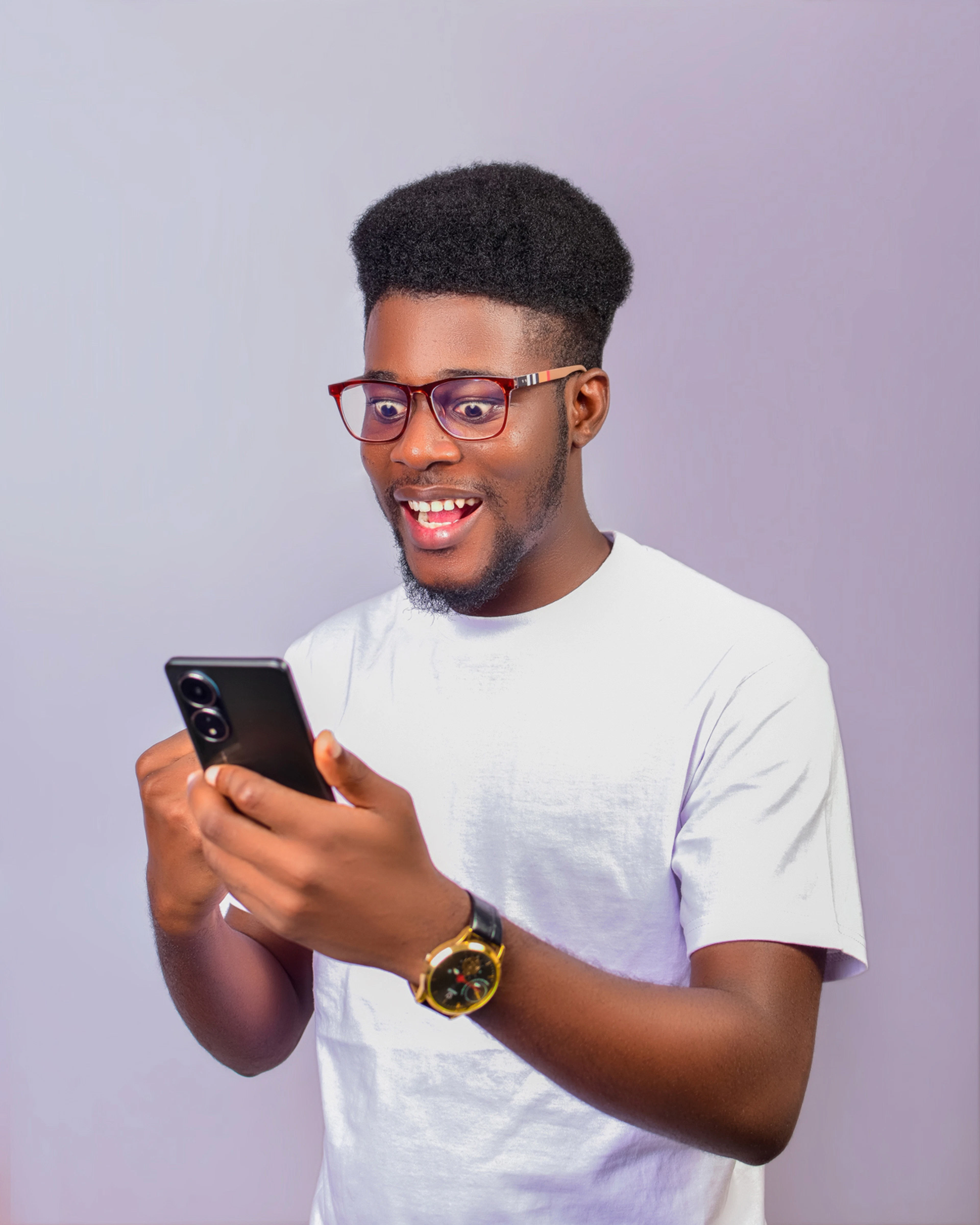 Man smiling at his phone