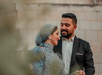A man and a woman standing next to each other
